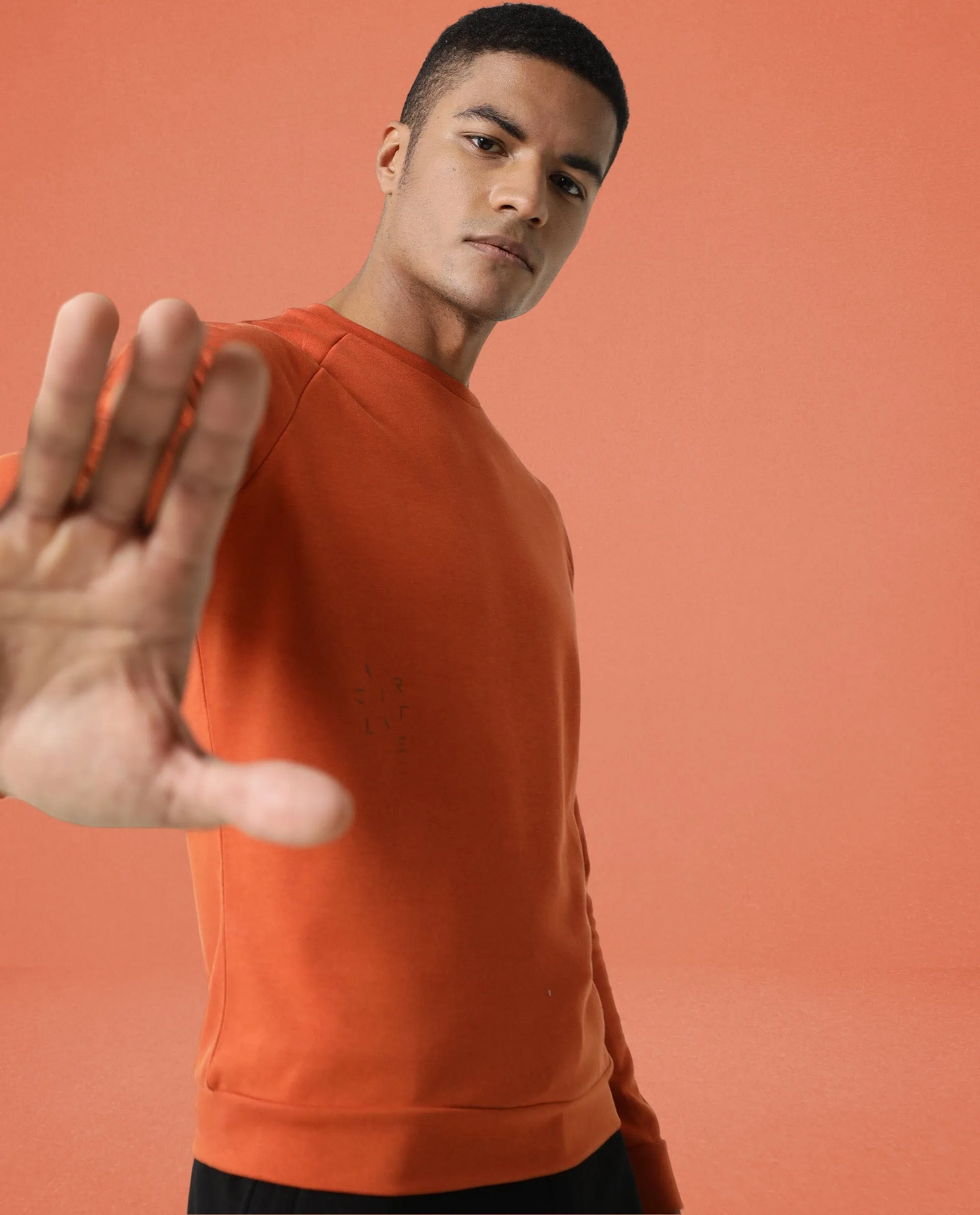 Rare Rabbit Articale Men's Arum Tangy Orange Cotton Fabric Full Sleeves Solid Sweatshirt